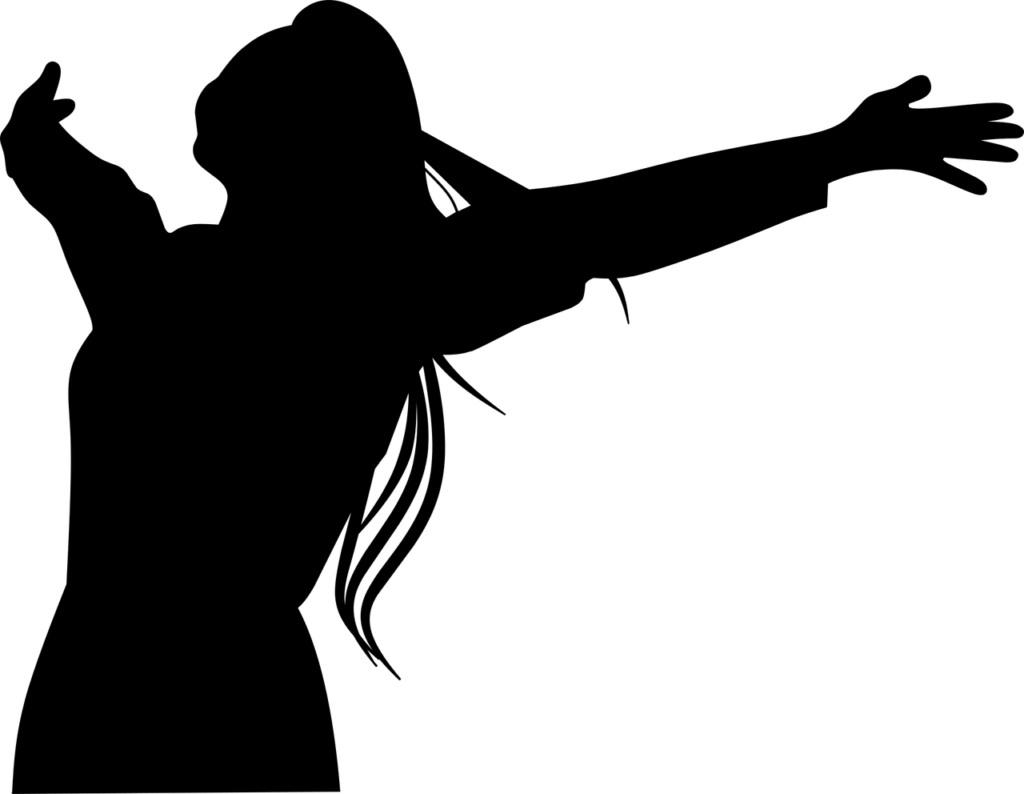 Silhouette of woman, expressing joy and feeling free